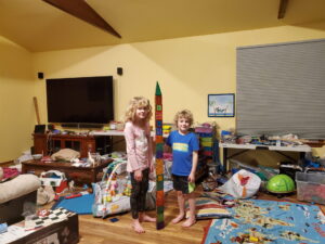 Arya and Evan standing next to their tower