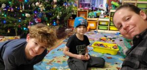 Meagan, Jarek, and Evan hanging out in our play area next to our Yule tree.  This was one of the larger trees we have had as a family.