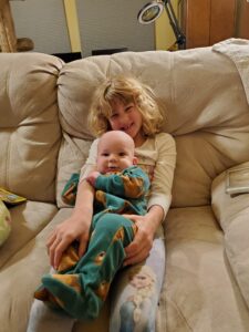 Arya (and the other children) loved to help hold Garrett.