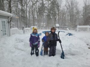 Our snow clearing team posing on the deck. 