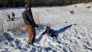 Back out to the sledding hill after the fresh snow. Here Alan is building a snowman with Arya. 