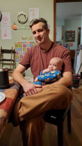 Garrett chilling with Daddy at the table. 