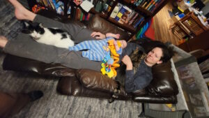 Sleepy peanut and Meagan relaxing in front of our wood burning insert. 