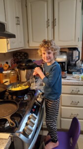 Evan helping to make scrambled eggs for breakfast. He has taken quite the liking to helping cook. 