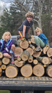 Alan's truck is loaded up with firewood. Jarek, Arya, and Evan made quite the helper team moving the wood!