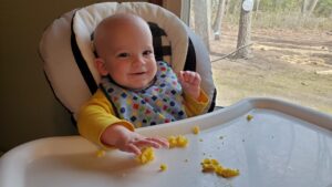 A happy Garrett enjoying his breakfast of scrambled eggs!