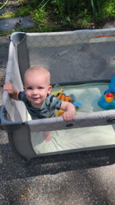 Garrett enjoys some outside time and supervises the activities. 