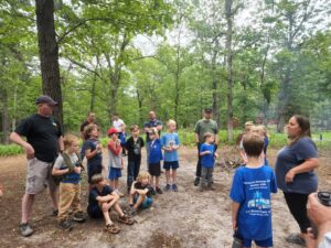 The Scouts gather around before going on a nature walk to learn about the local flora and fauna. 