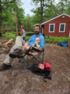 Alan, now in full retirement beard, and Garrett chill at camp and supervise the camp fire. 