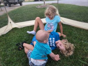 Garrett wrestles with big brother and sister!