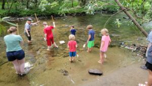 When we got to the visitor's center, partway through the driving tour, there was an opportunity for the kids to help out with the Rangers and do some counting of critters in the river. They were able to catch some fish and river insects and learn about them. 