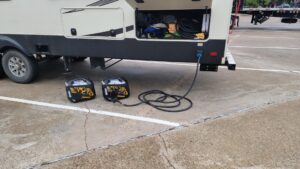 Here we are at the Texas Welcome Center, just across the state line. We brought the kitchen slide out to access the bathroom. When we were done, Alan was unable to close up the slide. So, Alan dragged out the two small generators we carried for this purpose. Alan hooked them up and they provided enough power to close up the slides. 