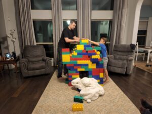 Uncle Brian and Cousin David putting the finishing touches on the roof. 