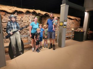 Family shot next to the life size cutout of the previous resident of the house. Our model might need higher ceilings. 