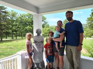Family picture with the cutout of Laura Ingalls Wilder. She was of a surprisingly small stature. We had a great time touring the grounds and learning about the story of her life and writing the books. We learned about a couple other books and the back story behind the writing of the books, as well as farm life. 