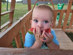 Gratuitous glamour shot of Garrett loving on some watermelon at the playground!