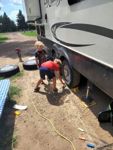 Pit crew in action! Jarek and Evan helped me out and learned a bit about changing tires. 