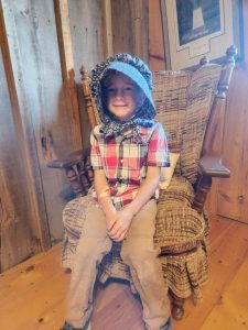 Evan modeling a bonnet. 