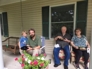 Alan with Uncle Gerald and Aunt Barb on the porch. 