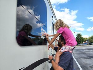 Arya helps add the last stickers to the map. Ohio and Pennsylvania!