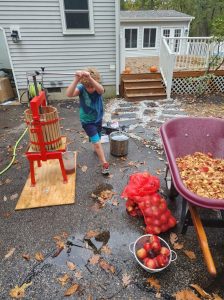 Jarek puts the last few turns on this batch of apples. 