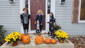 The crew ready to roll with their skeleton and pumpkins!