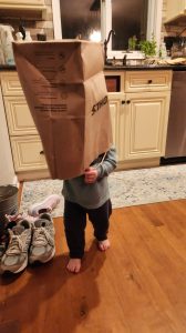 Garrett tries out some camouflage to sneak around in. 