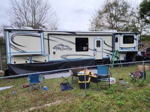 RV maintenance - Prepping for sealant removal and replacement. Alan used the 3M 5200 Fast Cure product to reseal all of the joints. 