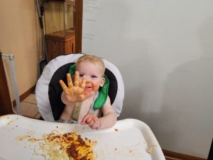 Garrett enjoys some tasty pasta and sauce!